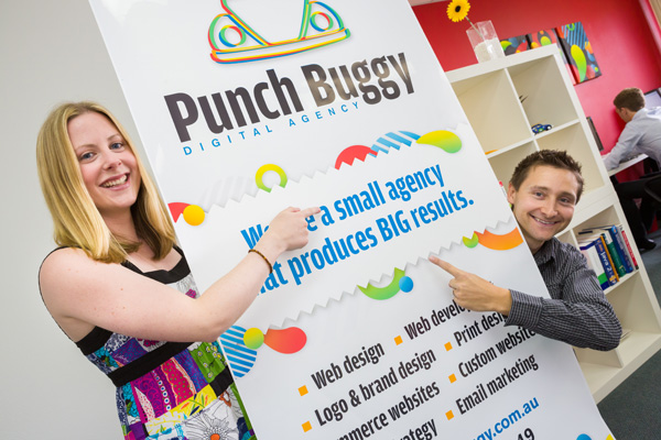 Small and Big - Emily and Ryan with their pull up banner